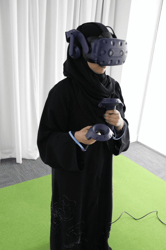 saudi woman corporate training using a vr headset Biz Group KSA