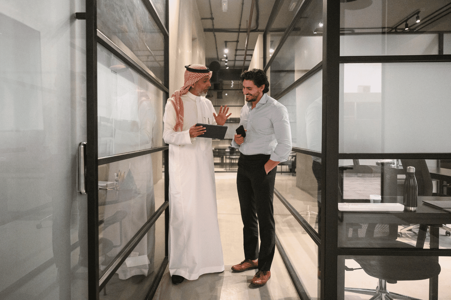 diverse saudi management coaching and mentoring fellow manager